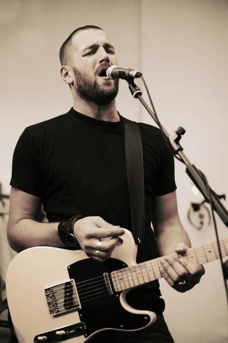 Independent artist performing vocals and acoustic guitar live